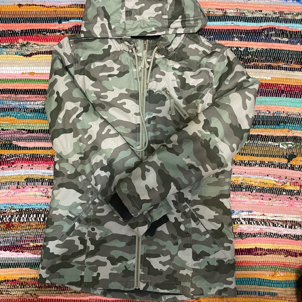 Green winter camouflage light winter jacket. New